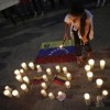 Press Conference with Attorney Margaret Donnelly and Congressman Marc Veasey Regarding Crisis In Venezuela Girl lighting SOS Venezuela candles