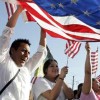 The Importance of the Immigrant Voice: Voting Rights for the Foreign-Born immigrants celebrating with US flag