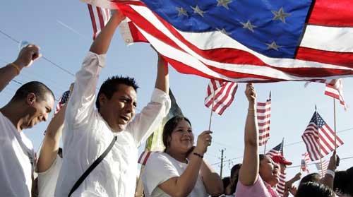 immigrants celebrating with US flag